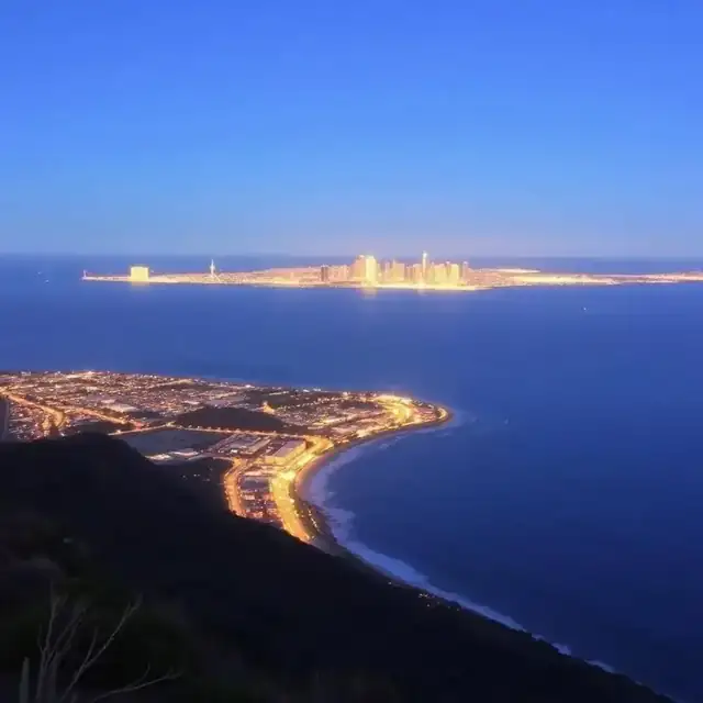 Panoramic sunset view of the San Diego skyline and coastline from Mount Soledad