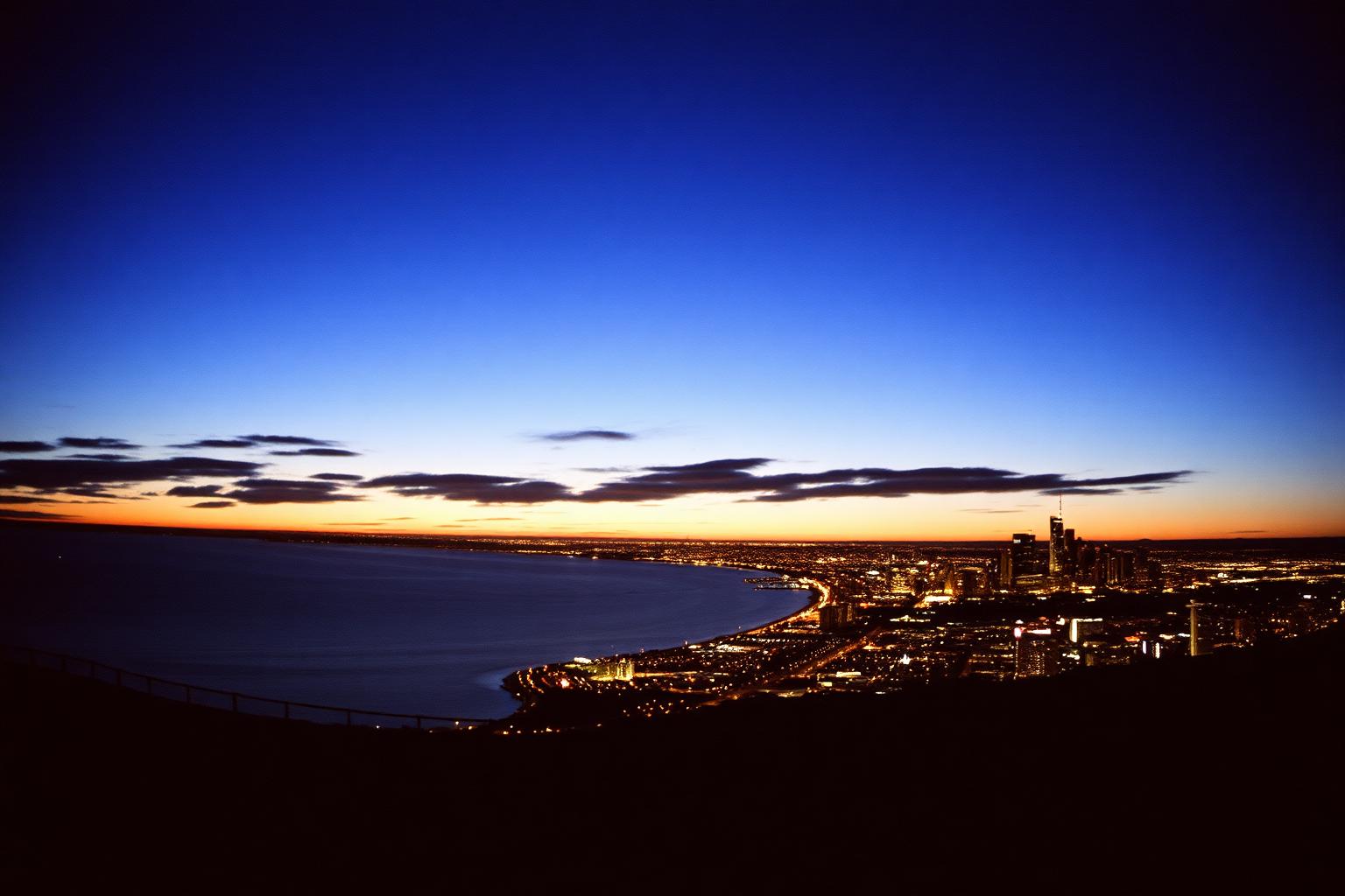 Panoramic golden hour view over San Diego bay and downtown skyline from a hilltop overlook