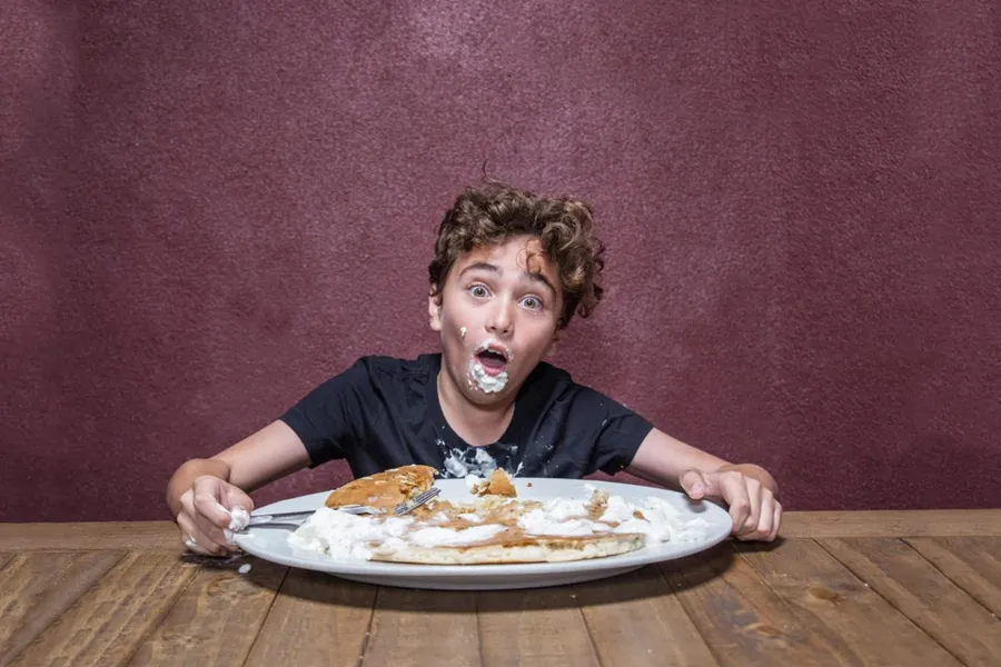 Oversized Hash House A Go Go pancake filling an entire plate