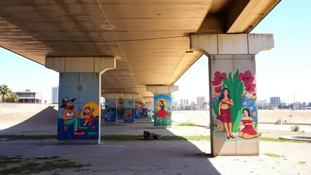 Vibrant Chicano Park murals on concrete bridge pillars in Barrio Logan, San Diego