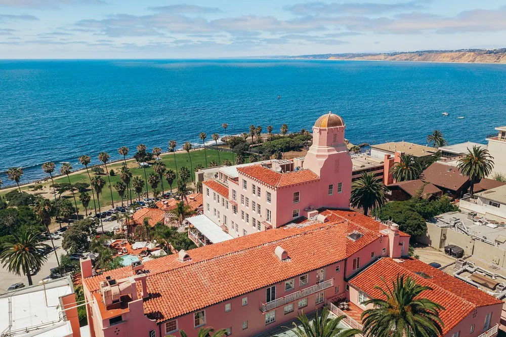 Aerial view of the pink La Valencia Hotel above La Jolla Cove