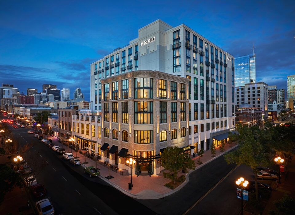 Exterior of the Pendry San Diego hotel on Fifth Avenue in the Gaslamp Quarter at dusk