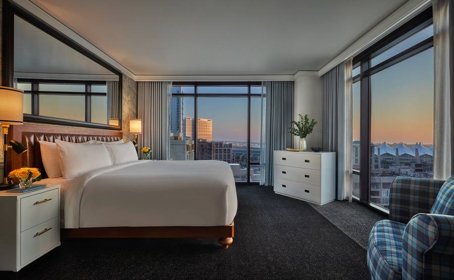 Grand suite guest room at the Pendry San Diego with floor-to-ceiling windows and city views