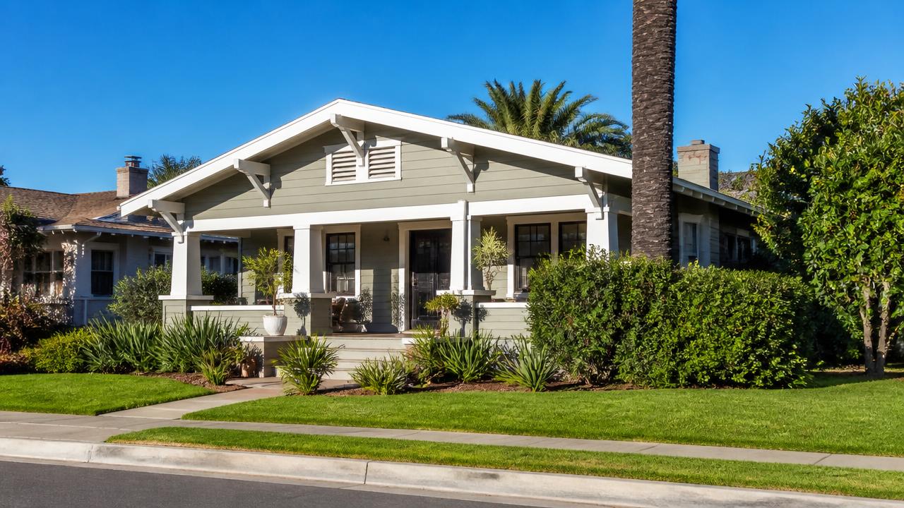 Tidy Southern California craftsman bungalow with a wide front porch on a quiet residential street
