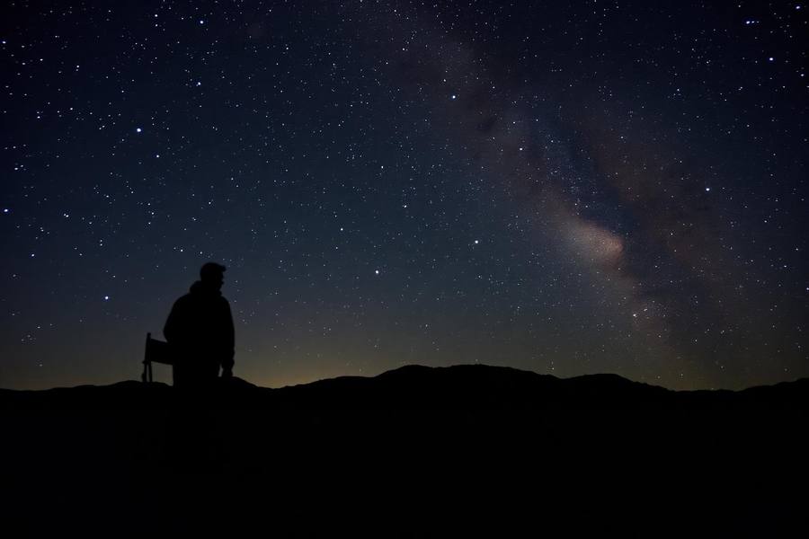 Milky Way arcing over desert rock formations in the Anza-Borrego backcountry at night