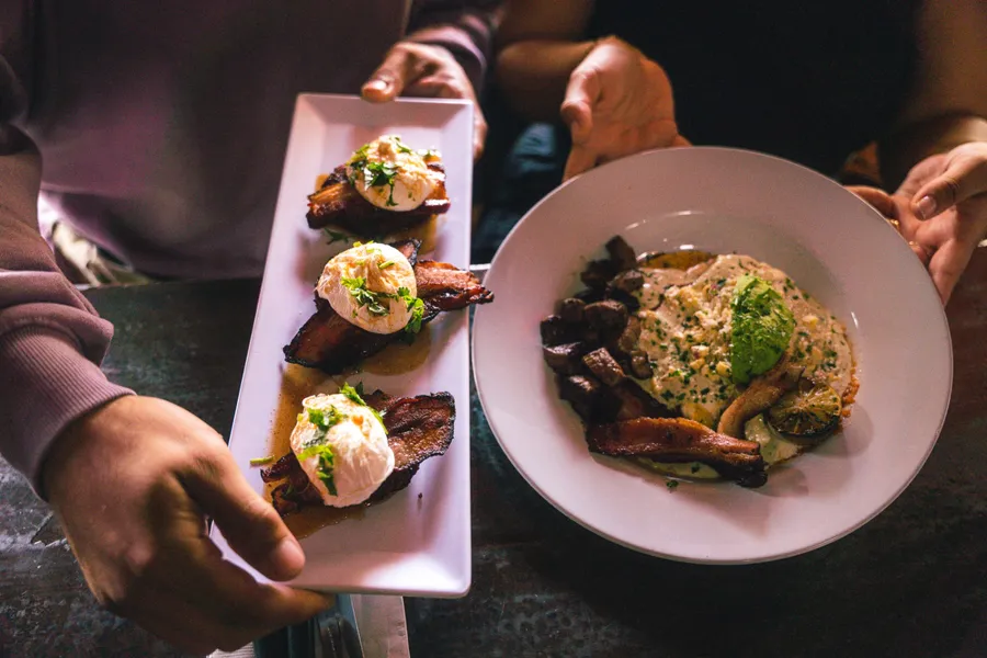 Brunch plates on the table at Werewolf American Pub in the Gaslamp Quarter